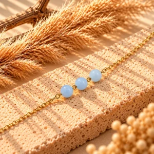 Accueil 42 Bracelet Chaine Dorée Anne en Aigue Marine - Amour